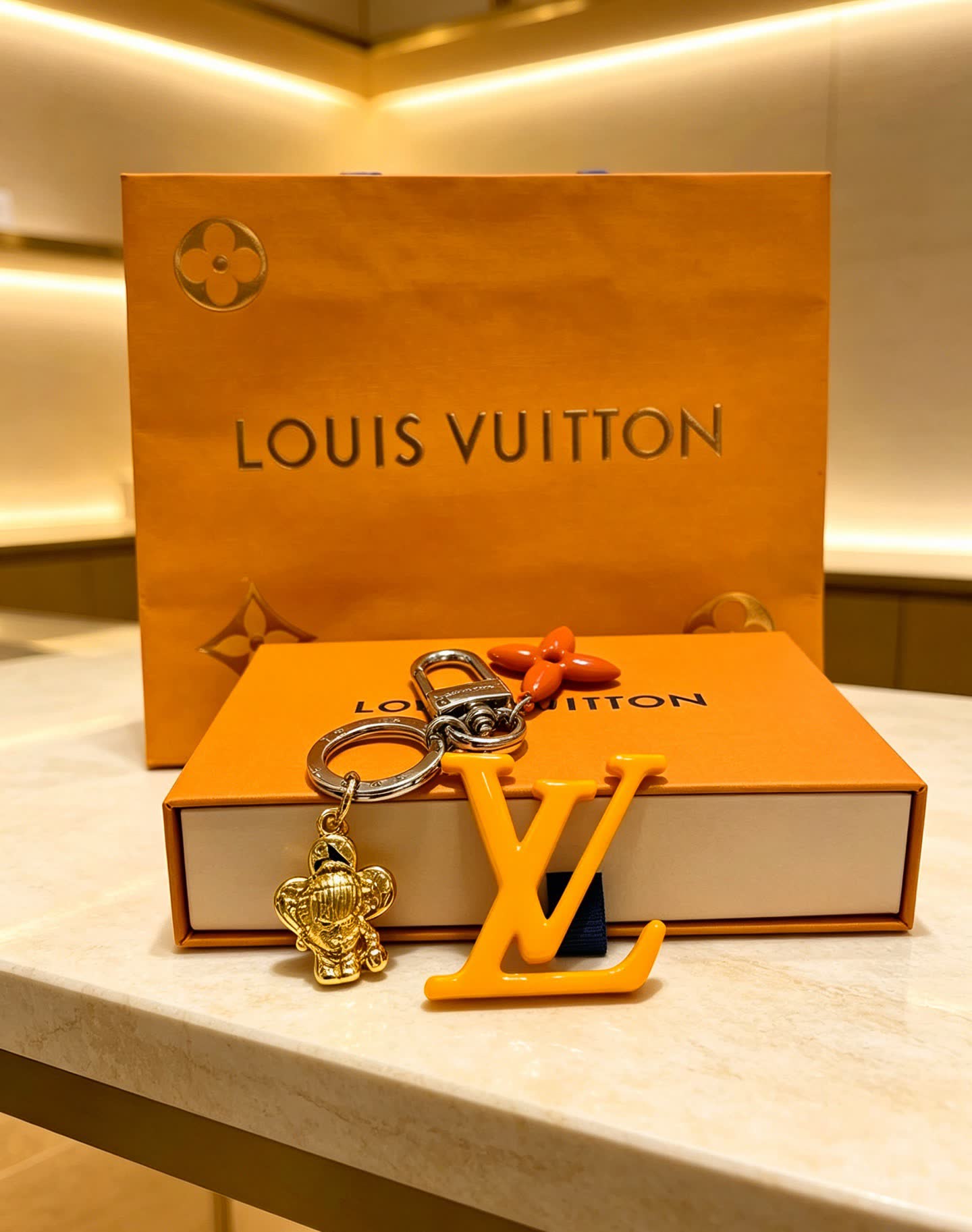 Louis Vuitton Keychain with LV Logo and Monogram Motif